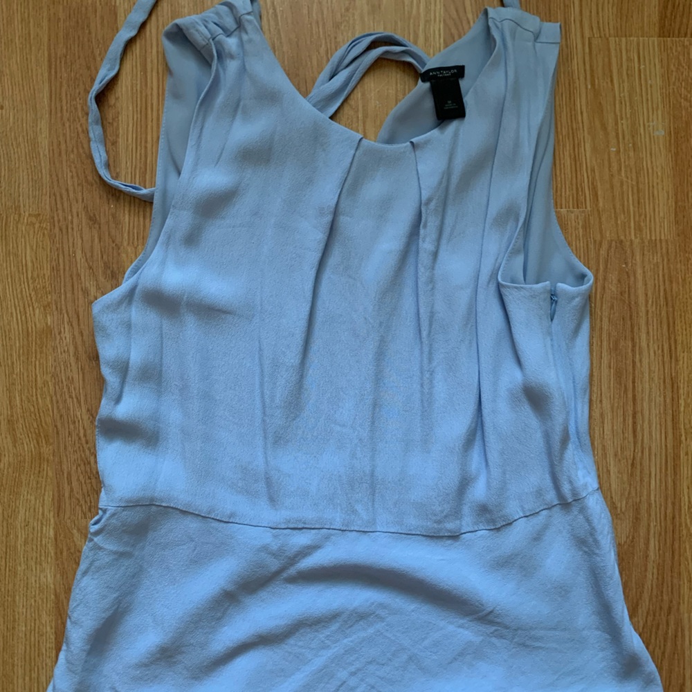 Dressy sleeveless work shirt, ties in the back, never worn!